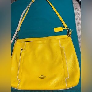 Yellow coach wallet is really a charm in very good condition